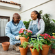 Happy African senior people gardening together at home - PhotoDune Item for Sale