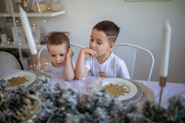 Children are sitting at the table - Stock Photo - Images