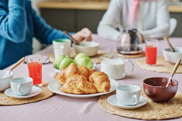 Senior people having breakfast at table - Stock Photo - Images