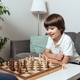 Toddler happy boy plays chess at home - PhotoDune Item for Sale