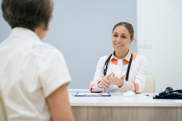 Therapist conducts a reception in a bright office - Stock Photo - Images