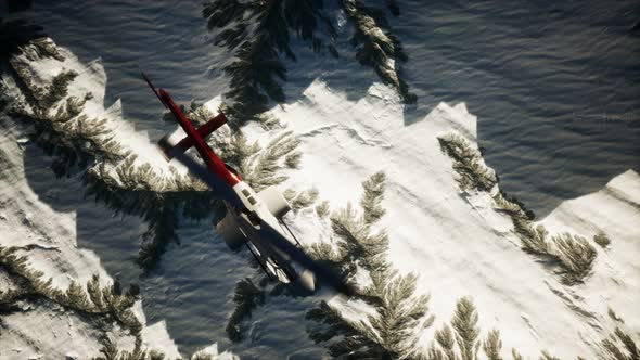 Helicopter Above Mountains in Snow alt