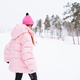 Young red haired woman in pink sportswear and sunglasses on winter snowy background - PhotoDune Item for Sale