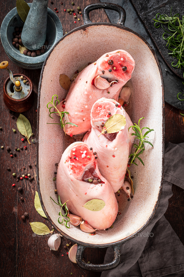 Preparation for roasted ham hock in casserole with spices. Stock Photo
