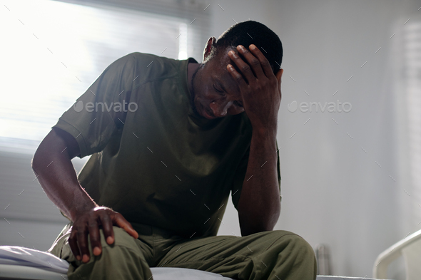 Military Man Suffering from Severe Headaches - Stock Photo - Images