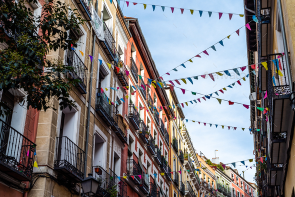 Street decorated with pennants in the traditional neighborhood of Embajadores - Stock Photo - Images