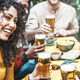 Happy friends cheering beer glasses at brewery pub restaurant  - PhotoDune Item for Sale