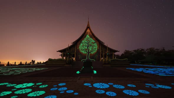 Time lapse of Wat Sirindhorn Wararam or Wat Phu Prao temple with star trail at night alt