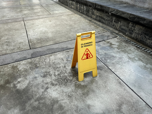 Yellow Sign on the Floor with Cleaning In Progress Message