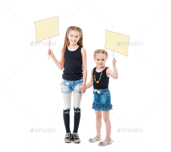 sibling sisters holding hands, blank posters