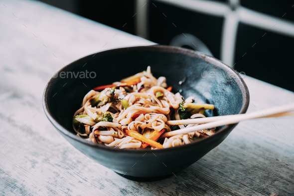 View osf asian noodles udon with pork close-up in a bowl on the table - Stock Photo - Images