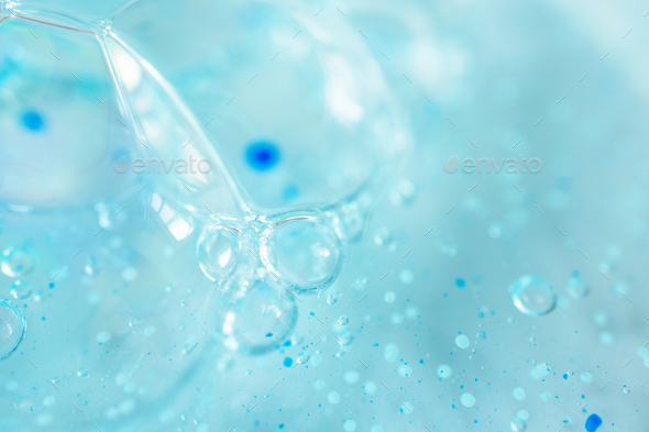 Extreme macro bubble blue shower gel with scrub grain texture with selective focus