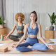 Yoga practice and meditation concept. Two women sit crossed legs on fitness mat breath deeply - PhotoDune Item for Sale