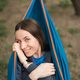 Smiling woman resting in a hammock - PhotoDune Item for Sale