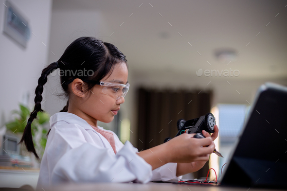 Asia students learn at home in coding robot cars and electronic