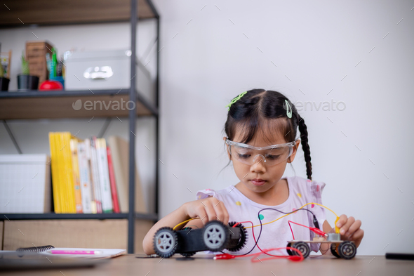 Asia students learn at home in coding robot cars and electronic