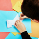 Boy making paper dog origami - PhotoDune Item for Sale