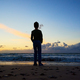 Child silhouette standing on sea beach and looking on waves - PhotoDune Item for Sale
