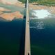aerial car bridge over river with sandy dunes coast - PhotoDune Item for Sale