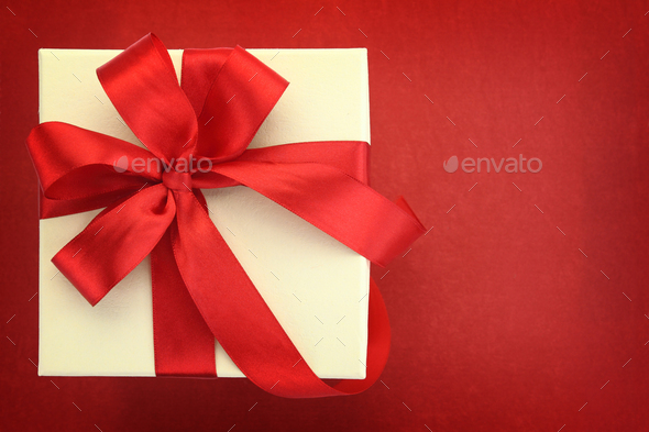 Close up of gift box on red background - Stock Photo - Images