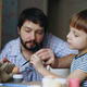 father and kid painting eggs for easter - PhotoDune Item for Sale
