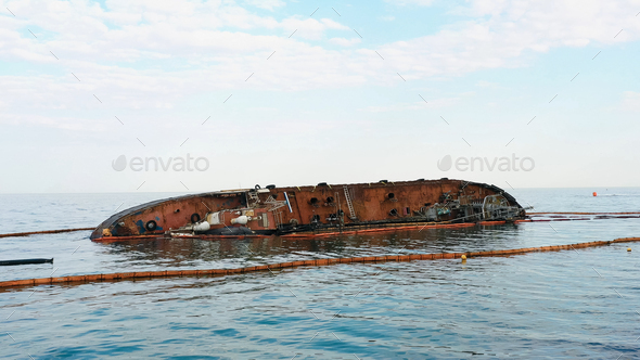 Sunken drowned tanker ship near the aground. - Stock Photo - Images