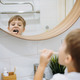 cute 5 years old boy brushing teeth with bamboo tooth brush in bathroom. Image with selective focus - PhotoDune Item for Sale