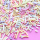 Pastel sprinkles on a pink background - PhotoDune Item for Sale