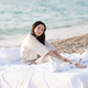 Smiling woman wear pajama in bed resting over sea background outdoor - PhotoDune Item for Sale