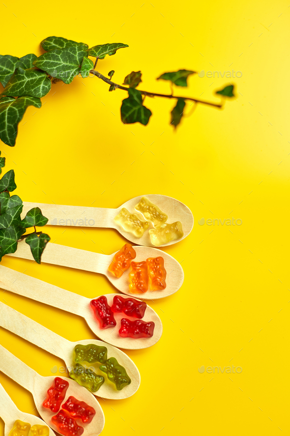 Flat lay composition with colored healthy vegan gummy bears - Stock Photo - Images