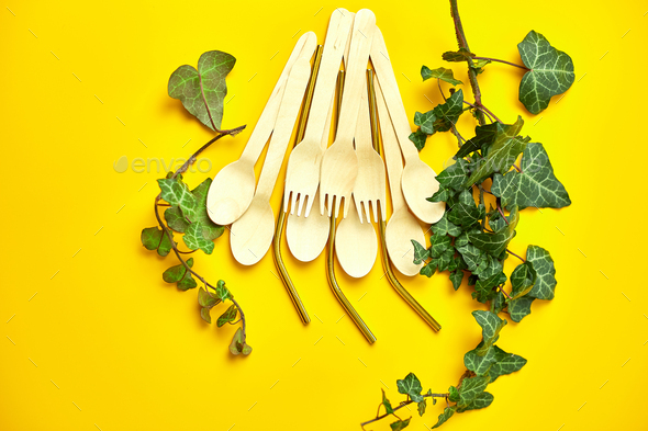 Flat lay reusable stainless steel straws and eco wooden spoons - Stock Photo - Images