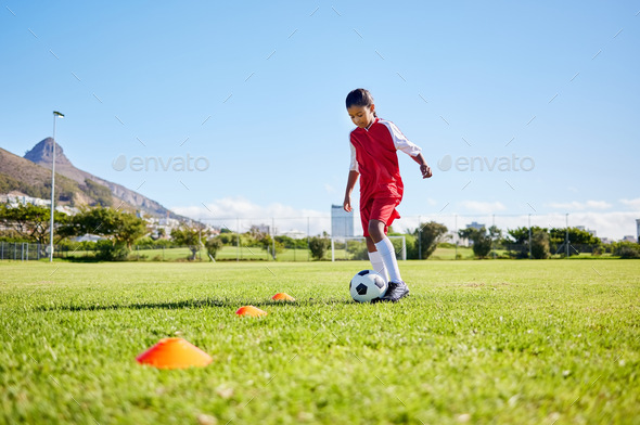 Football girl kid, training and grass for fitness, speed or balance with sport talent development,