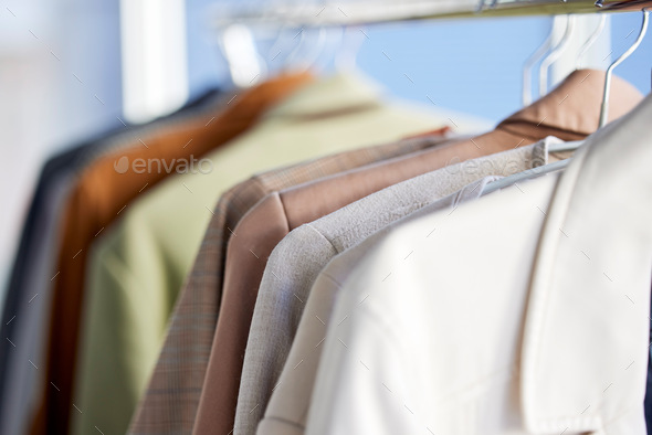 Shirts, clothes and closet in a home with fashion, style and organized. Neat, tidy and clean work c