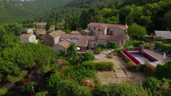 Approaching rustic villa in Branoux-les-Taillades Southern France with empty pool area for remodelin alt