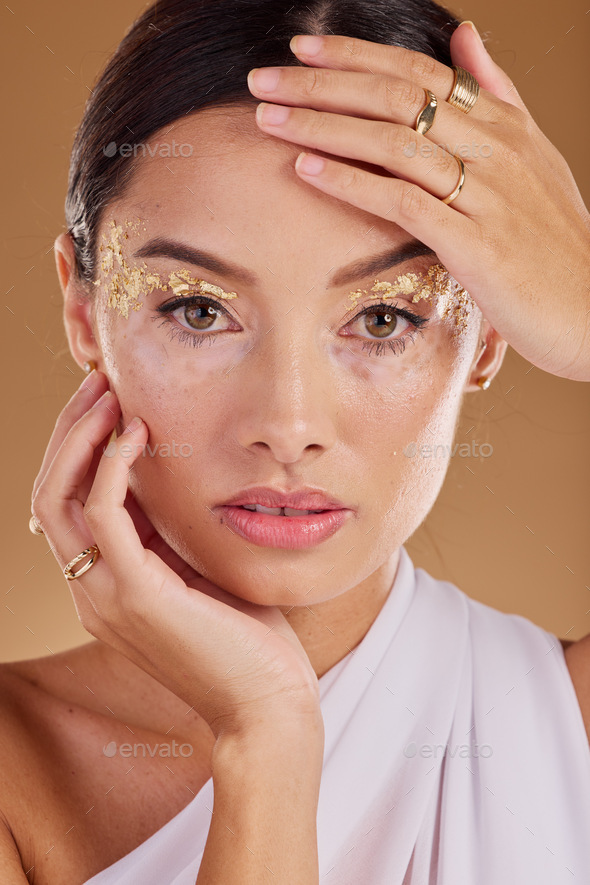 Gold makeup, face glitter or woman with luxury eyeshadow, cosmetics product  and skincare glow. Beau Stock Photo by YuriArcursPeopleimages