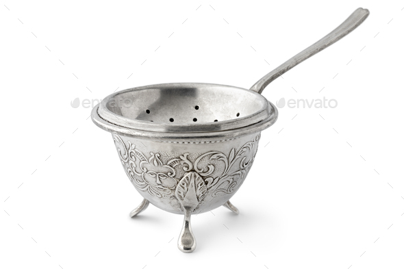 Antique old fashion silver tea strainer and standon white background - Stock Photo - Images