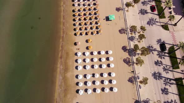 Concept of summer vacation. View from above, aerial view of an amazing beach with beach umbrellas an