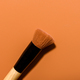 Makeup foundation brush on brown background - PhotoDune Item for Sale