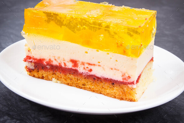 Creamy sweet sponge cake with different layers and jelly. Dessert for celebrations - Stock Photo - Images