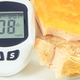 Glucometer with high sugar level and creamy fruit cake with jelly - PhotoDune Item for Sale