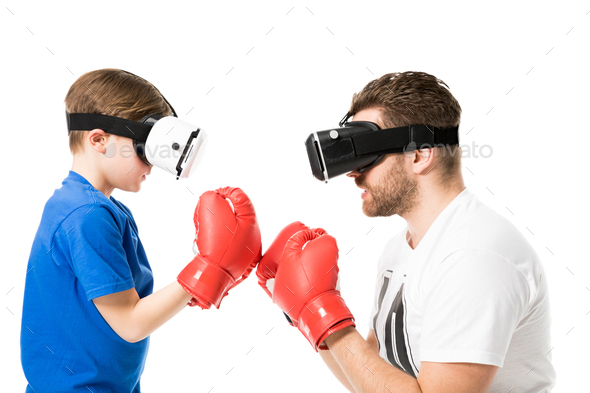 side view of father and son boxing in virtual reality headsets isolated on white - Stock Photo - Images
