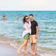 Young couple on white beach during summer vacation. - PhotoDune Item for Sale