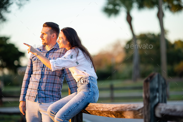 Happy couple in the park on summer day outdoors - Stock Photo - Images