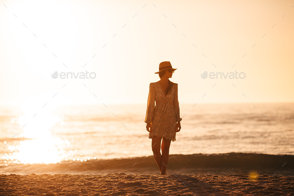 Young beautiful woman on the beach vacation - Stock Photo - Images