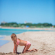 Adorable little girl playing with beach toys during tropical vacation - PhotoDune Item for Sale