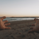 Pov of man hand opened and beautiful sunset lights with ocean and sky in background.  - PhotoDune Item for Sale