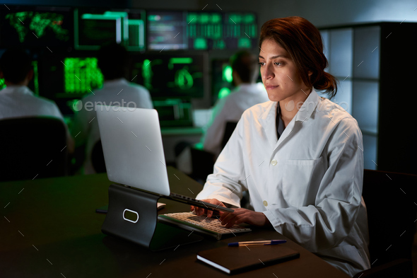 Medical Research Scientist Typing on His Desktop Computer in a Biological Applied Science Research