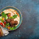 Middle Eastern Arab meal with fried falafel, hummus, vegetables salad space for text - PhotoDune Item for Sale