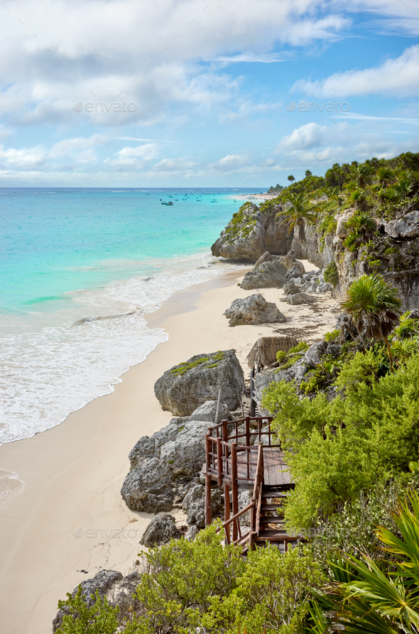 Rocky cliff at the tropical beach of Tulum, Yucatan Peninsula, Mexico. - Stock Photo - Images
