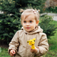 Little toddler baby girl in trench coat picking yellow dandelions in spring garden. Cute baby girl - PhotoDune Item for Sale